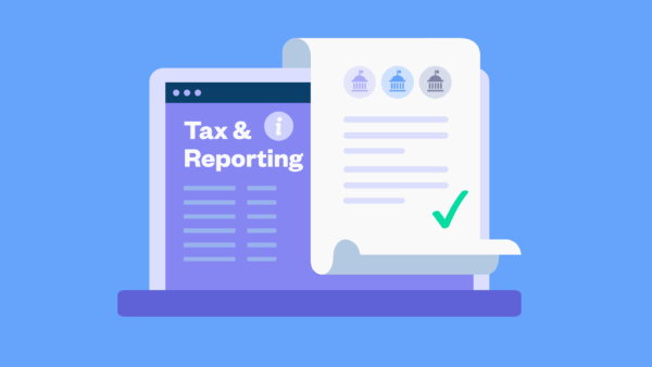 Laptop reading 'tax and reporting' with receipt on top